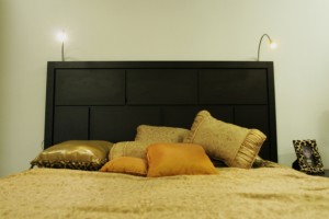 Headboard with adjustable goose-neck lamps